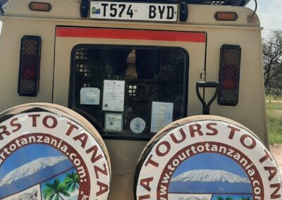 Tour To Tanzania Safari Vehicle Back View with Travellers